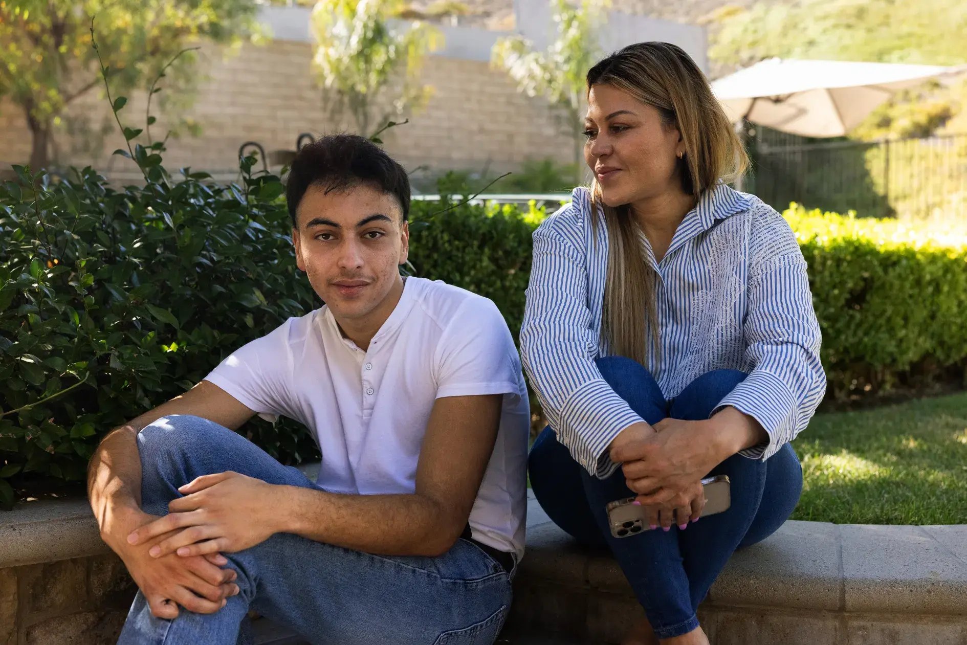 Jaime Meza, left, and his mother, Celia Meza, at home in Los Angeles County.