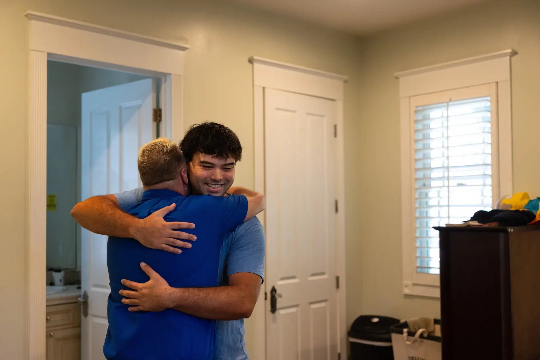 Hudnut embracing Brian Stark, executive director of Bridge Recovery Homes in Los Angeles, where Hudnut had lived and later worked.