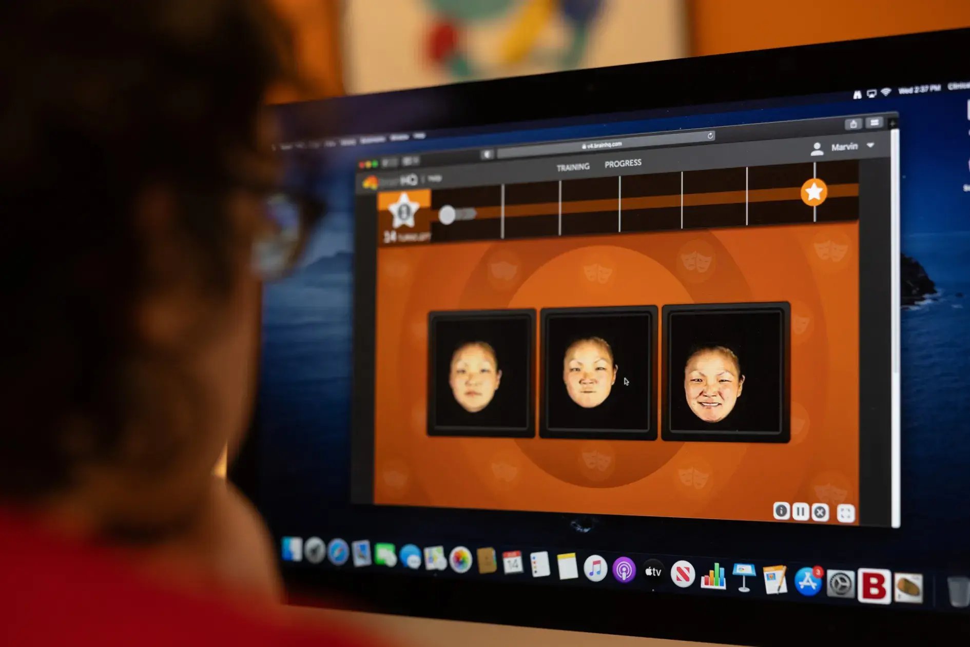 A patient at California OnTrack working on a computer to practice recognizing and matching facial expressions.